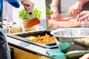 Chefs at work in a restaurant kitchen making delicious food