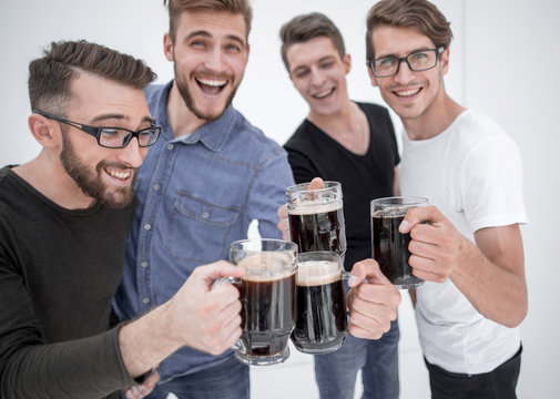 Funny young people with a beer mug full of beer