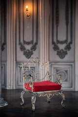 Interior of the room with a red armchair in vintage style