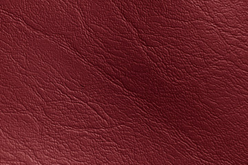 Red genuine leather texture background abstract art detail.
