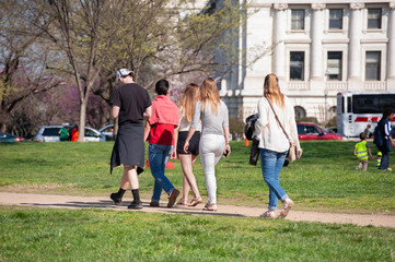 A group of teenagers explore the area around the National Mall near the Smithsonian complex.