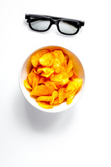 concept of watching movies with chips top view white background