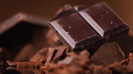 Chocolate. Assorted chocolate sweets and candies rotated over dark background. Confectionery concept. Rotation. Slow motion 4K UHD video 3840X2160 - Powered by Adobe