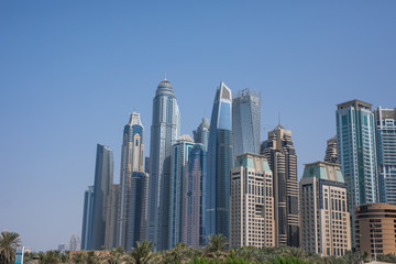 Obraz premium Skyscapers next to the beach in Dubai Jumeirah beach. Landscape view.