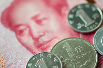 Close up of China Yuan coins and banknote for saving investment and business concept.