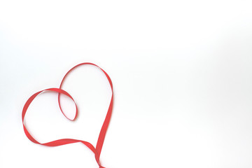 Heart of red satin ribbon on white background. Valentines day