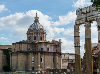 Fototapeta na wymiar View on catholic church of Saint Luca e Martina (Chiesa dei Santi Luca e Martina) with remains of antique Roman forum in Rome, Italy