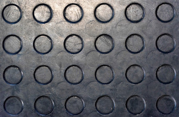 Close up black rubber mat texture with circles