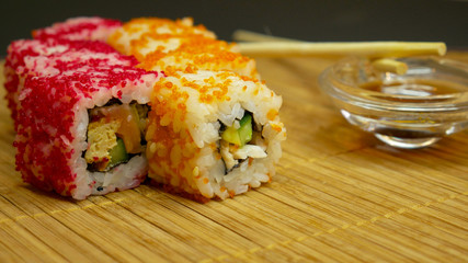 Sushi roll with soy sauce
