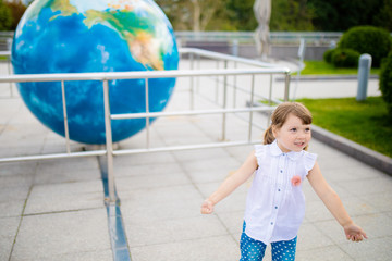 MOSCOW, RUSSIA - JULY 6: Exhibition in Moscow Planetarium. Little girl looking at the exhibits of the one of the world`s largest planetarium, star chart