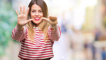 Young beautiful woman casual stripes winter sweater over isolated background showing and pointing up with fingers number six while smiling confident and happy.