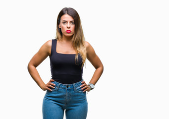Young beautiful woman over isolated background with serious expression on face. Simple and natural looking at the camera.