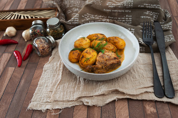 Piece of roasted pork and potatoes