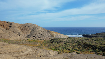 Mountain Pelada, locally known as Montana Pelada, an arid volcanic cone formed of fossilized sand dunes, situated at one end of El Medano surf resort in south of Tenerife, Canary Islands, Spain