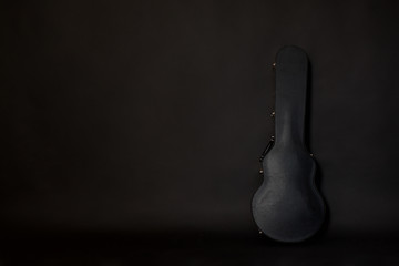 guitar case on dark background