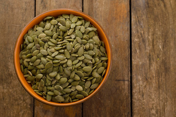 sunflower seeds in wooden spoon