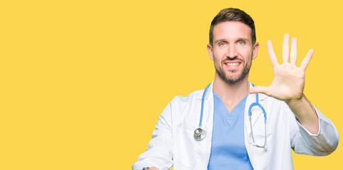 Handsome doctor man wearing medical uniform over isolated background showing and pointing up with...