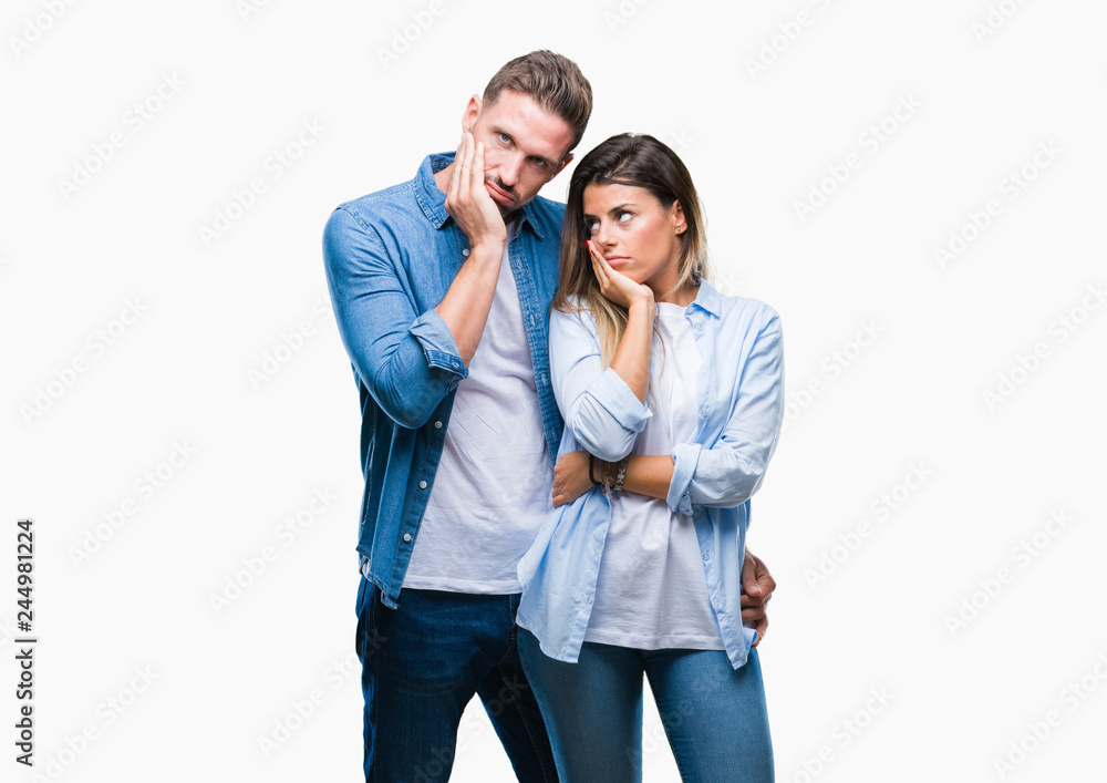 Wall mural young couple in love over isolated background thinking looking tired and bored with depression probl