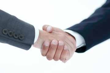 Closeup of business people shaking hands over a deal