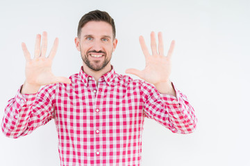 Young handsome man wearing shirt over isolated background showing and pointing up with fingers number ten while smiling confident and happy.