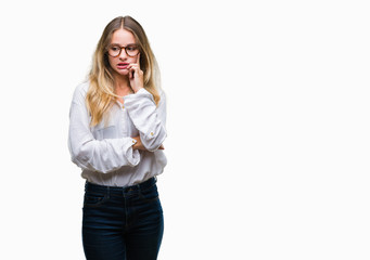 Young beautiful blonde business woman wearing glasses over isolated background looking stressed and nervous with hands on mouth biting nails. Anxiety problem.