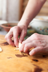 Process of cooking small croissants with cherry for breakfast. Preparation of baking on a rustic wooden background.