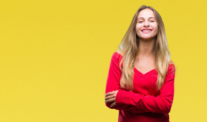 Young beautiful blonde woman wearing red sweater over isolated background happy face smiling with crossed arms looking at the camera. Positive person.