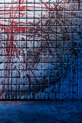 Cold and dark background from the scene of the murder. Dirty marble tile blurred by splashes of red...