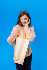 Young girl on a blue background isolated