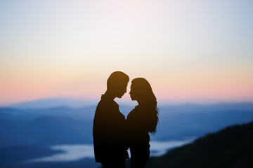 black silhouette couple lover hug together at outdoor background scene in valentine's day and romance moment	