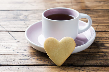 Heart home cookies and cup of coffee on a plate. Concept Valentine's Day