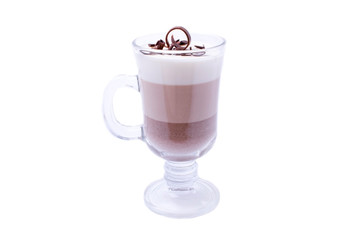 Layered chocolate dessert in an Irish glass mug. Isolated object
