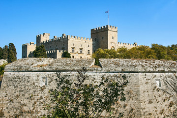 Fototapeta na wymiar The walls and turrets of the medieval castle of the Joannite Order in the city of Rhodes..