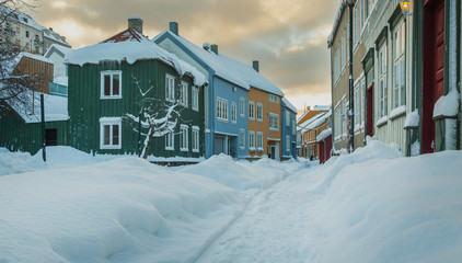 Baklandet street under snow. Wintertime in Trondheim, Norway. - Powered by Adobe