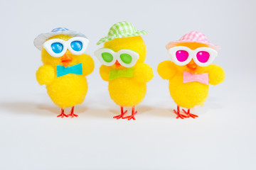 Easter decoration with three funny yellow chicks isolated on white background. Easter holiday concept.