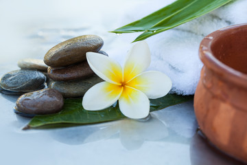 Fototapeta na wymiar spa objects and stones for massage on white background