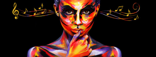 Portrait of the bright beautiful girl with art colorful make-up, bodyart and notes. Colorful paint...