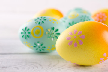 Easter holiday background with eggs. Close up of colorful painted chicken eggs