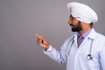 Portrait of young Indian Sikh man doctor