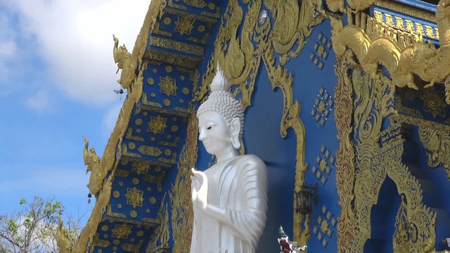  White Buddha sculpture in the Buddhist temple Wat Rong Sear Tean (Blue temple)
