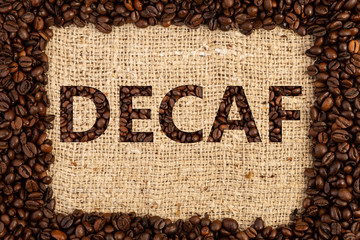 Decaf concept on brown coffee bag background.