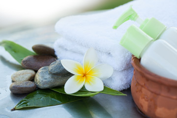 Spa objects and stones with two little bottles for massage