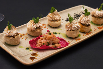 Kegs with salmon fish and cream sauce. Tasty restaurant dish