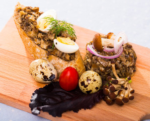 Delicious pate from button mushrooms with onion, quail eggs and greens