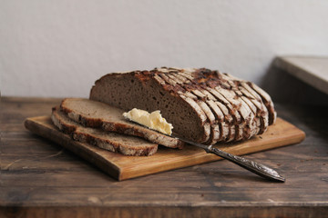 Fresh bread sliced on the board