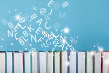 Row of of colorful books on  background