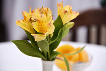 flowers and peaches. yellow lilies