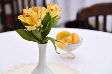 flowers and peaches. yellow lilies