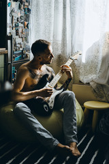 Young man playing the guitar