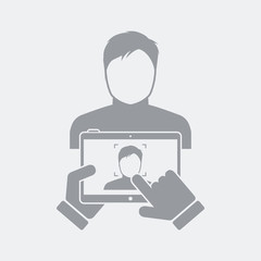 Tablet take a photo to guy